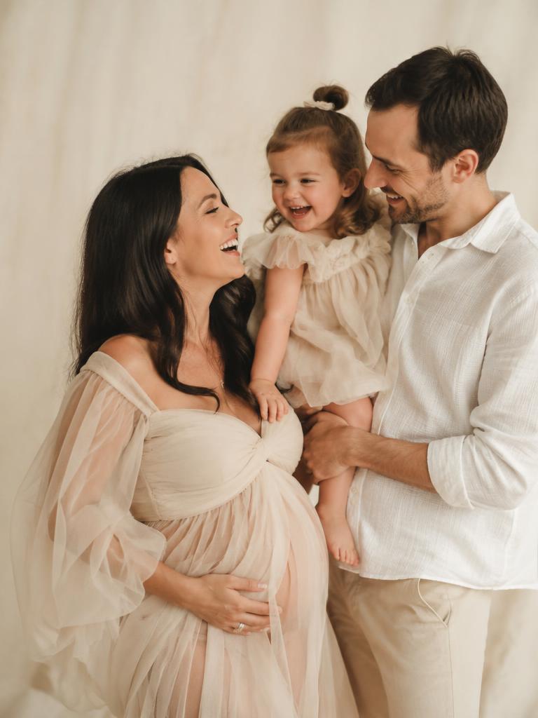 Family laughing together in the studio