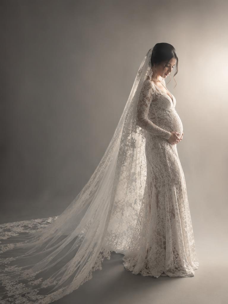Ivory lace gown with a long veil