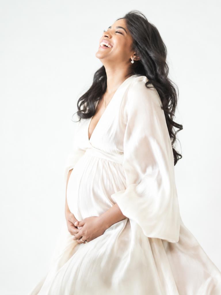 Laughter in a cream silk dress