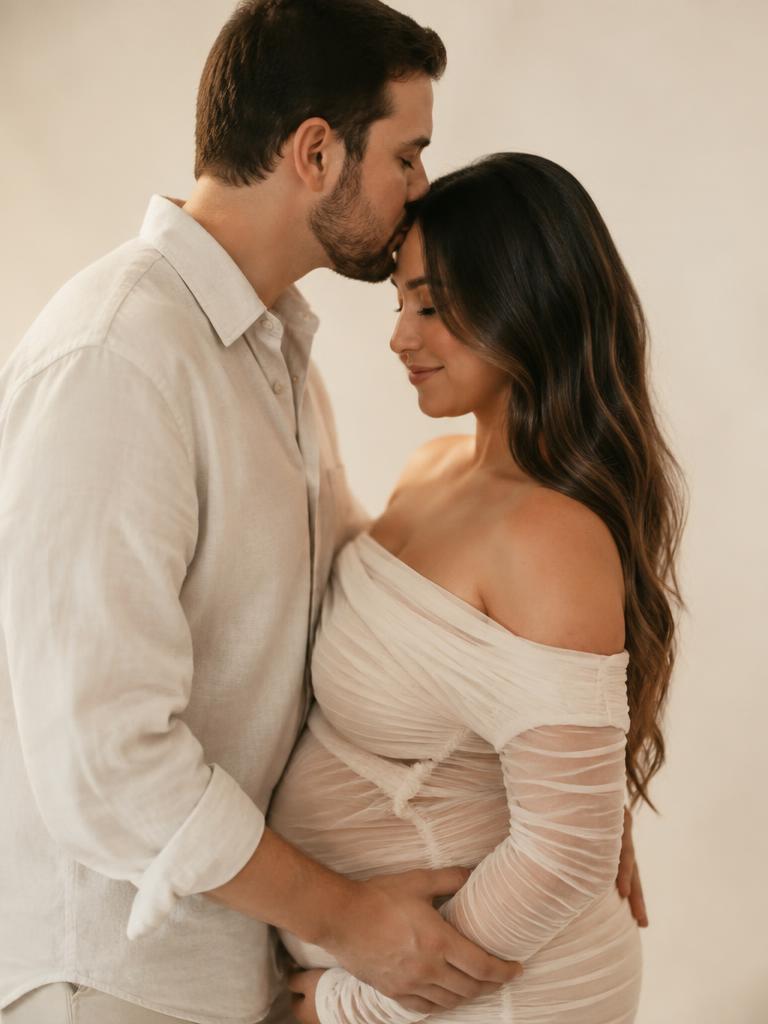 A forehead kiss in soft light