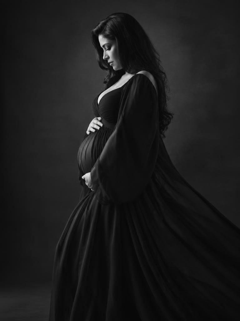 Black and white portrait in a dark gown